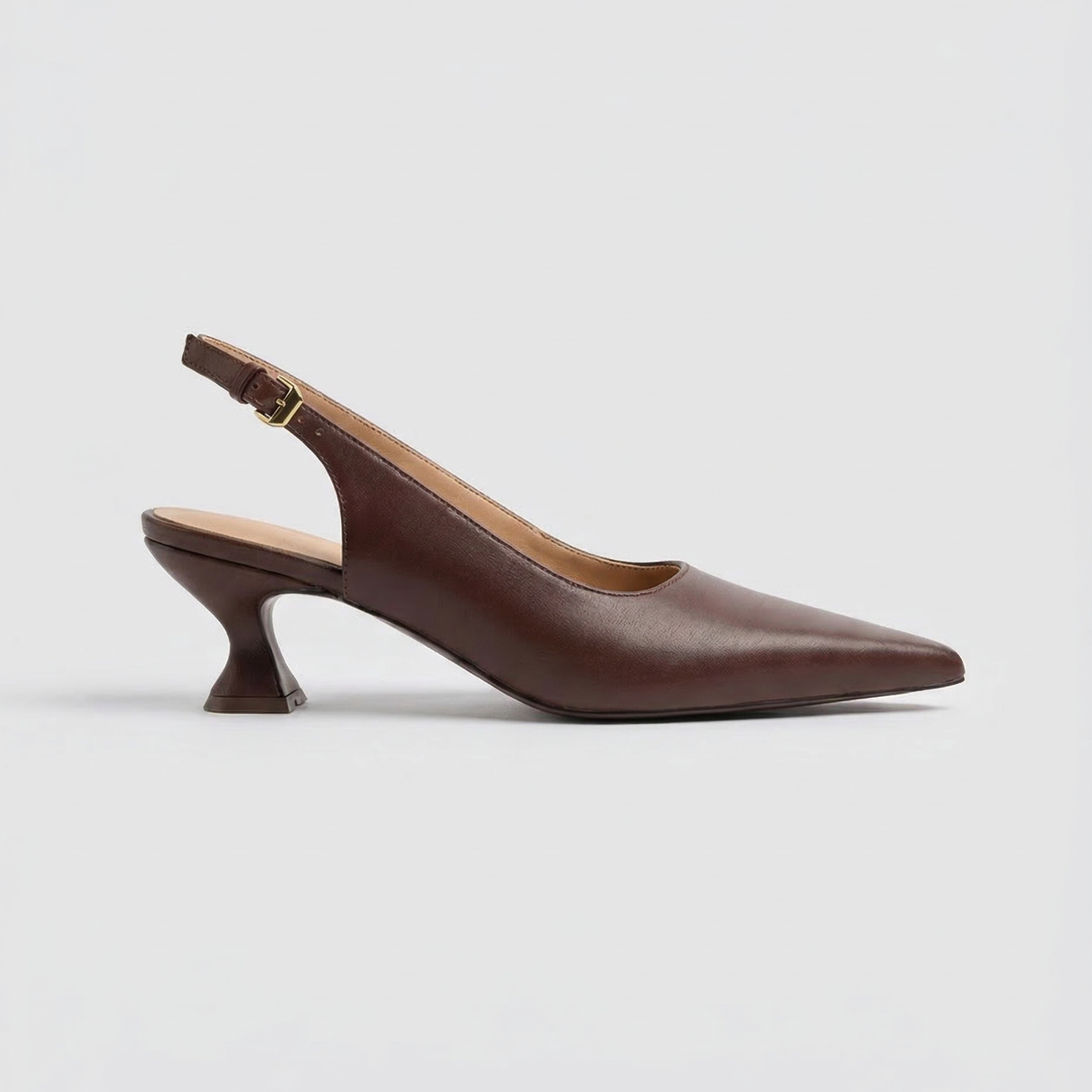 Brown leather pointed slingback heel with sculptural kitten heel by Bésyll